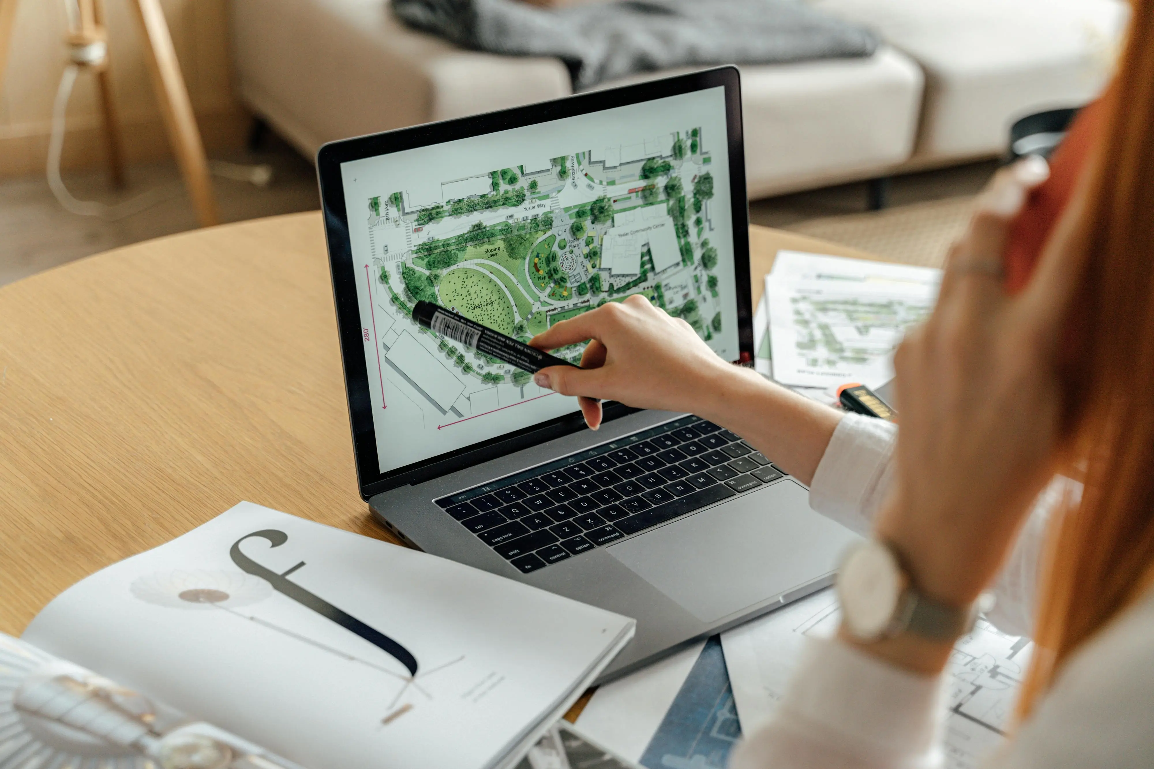Split screen showing AI garden design interface alongside traditional landscape architect working on plans